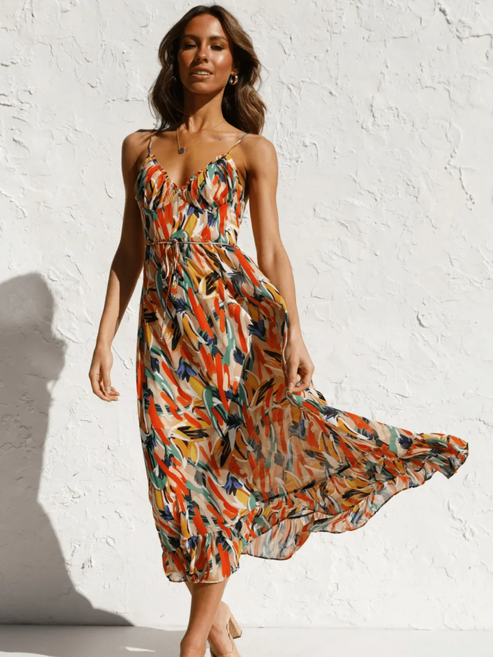 Chiara's | Farbiges Midikleid mit femininem Schwung und Muster