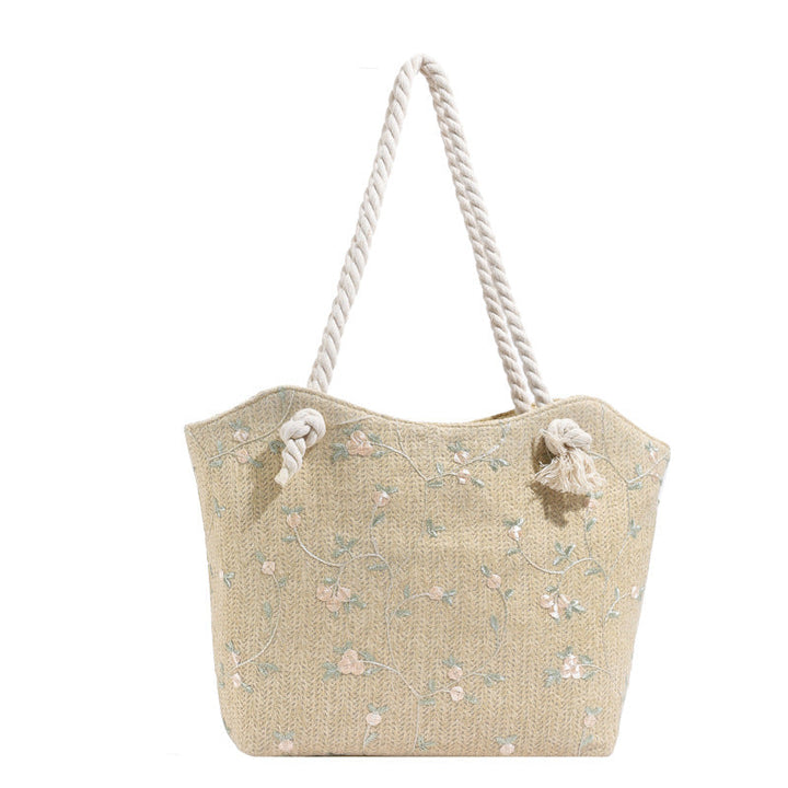 Umhängetasche aus Leder mit floralen Mustern