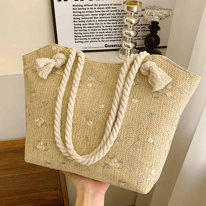 Umhängetasche aus Leder mit floralen Mustern