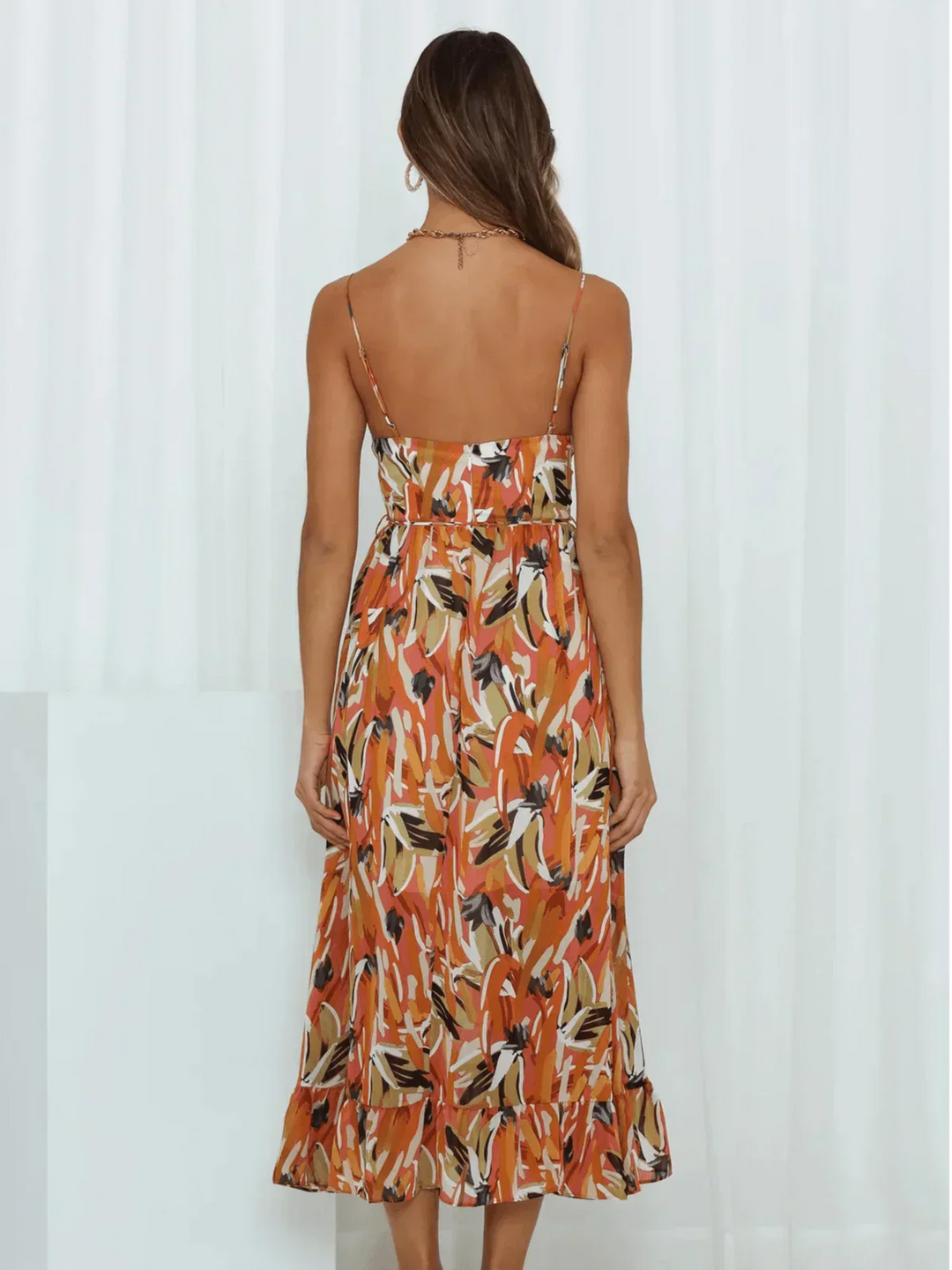 Chiara's | Farbiges Midikleid mit femininem Schwung und Muster