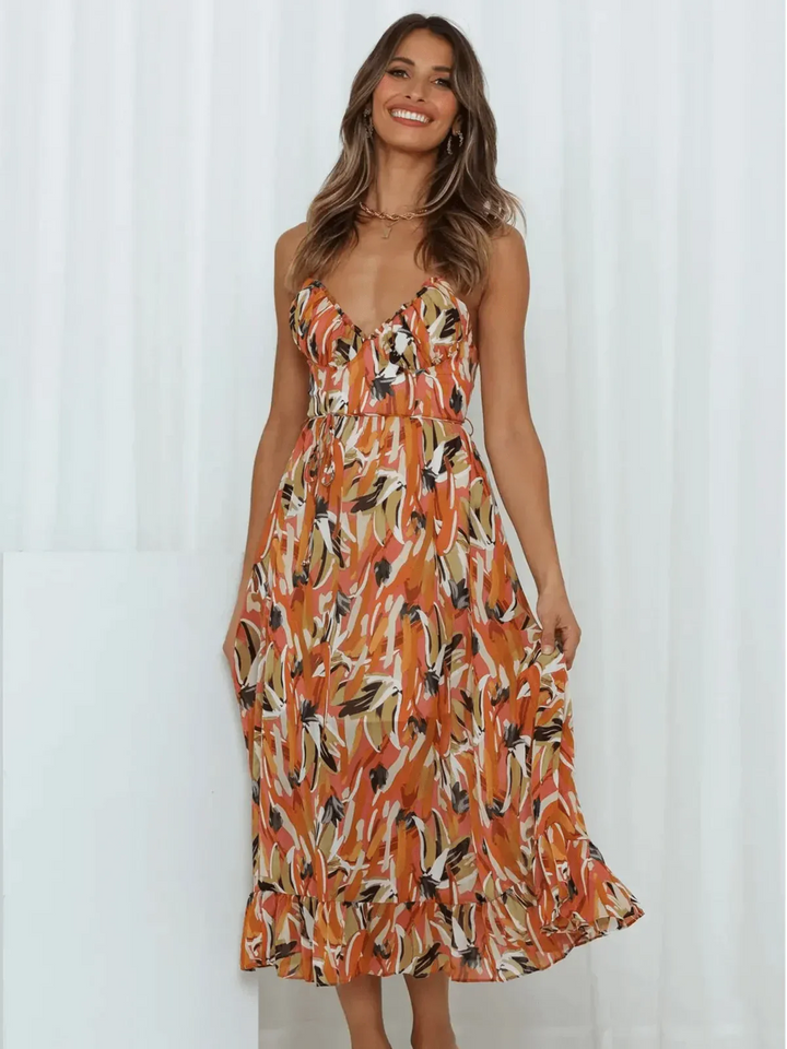 Chiara's | Farbiges Midikleid mit femininem Schwung und Muster